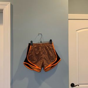 NWOT Nike Tempo Women’s orange leopard print running shorts (size XS)
